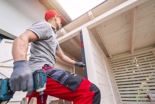 Caucasian,Construction,Worker,Using,Level,On,Wooden,Structure Caucasian,Construction,Worker,Using,Level,On,Wooden,Structure